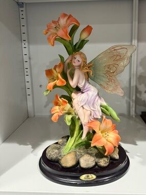 Delicate Fairy Figurine with Orange Lilies